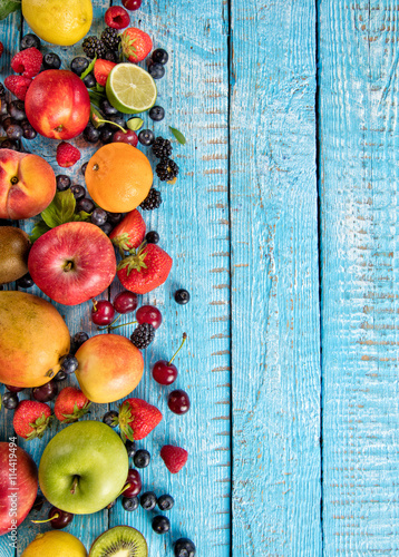 Fresh fruit mix placed on old wooden planks