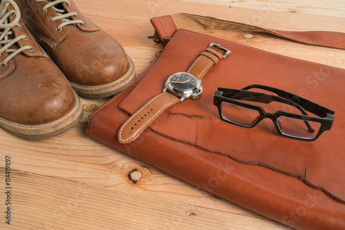 Men's casual outfits on wooden table 