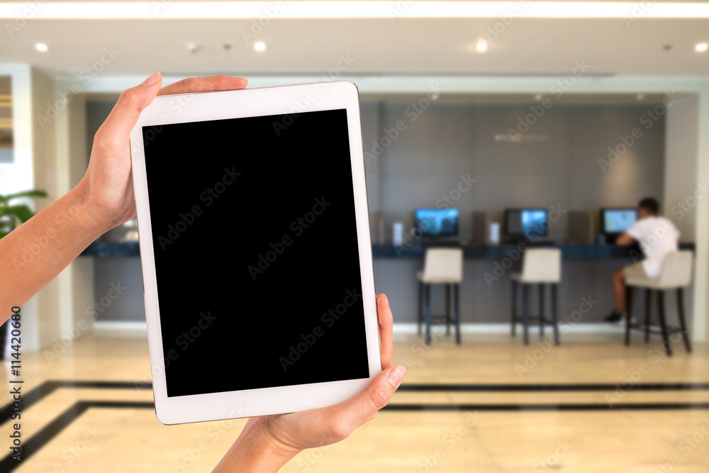 hands holding tablet with business corner background hands holding tablet with business corner background