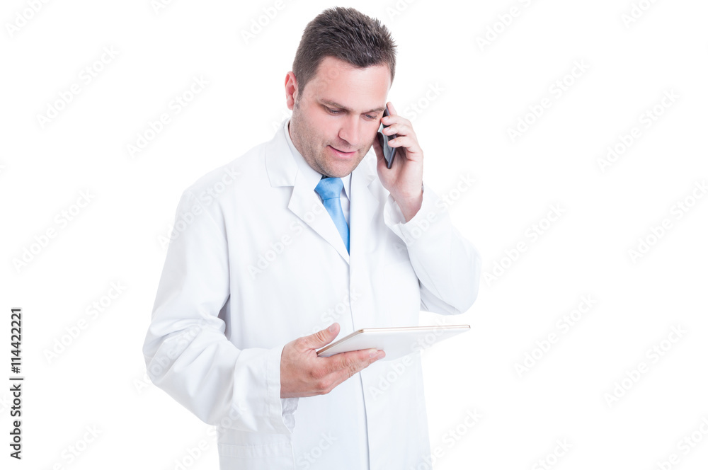 Male medic or doctor being multitasking with telephone and table Male medic or doctor being multitasking with telephone and table