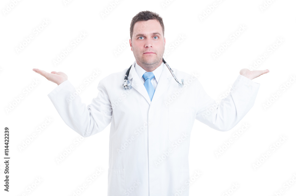 Young male doctor holding copyspace with two hands isolated Young male doctor holding copyspace with two hands isolated