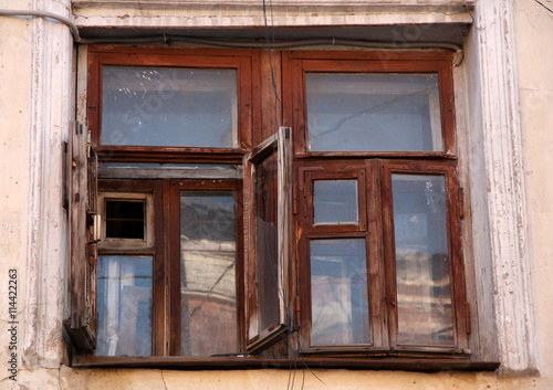 Old house with an antique wooden window