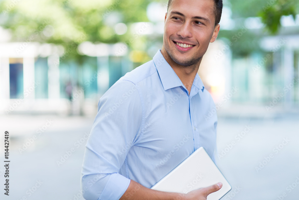 Young man with digital tablet outdoors
Young man with digital tablet outdoors