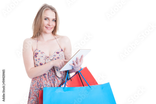 Online shopping concept with happy beautiful shopper holding mod photo