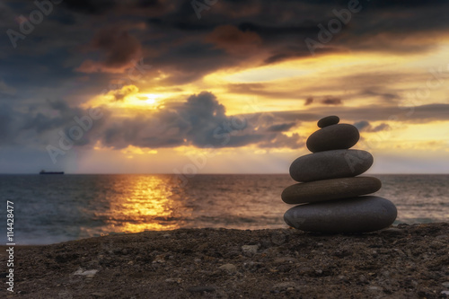 stack of zen stones at sunset