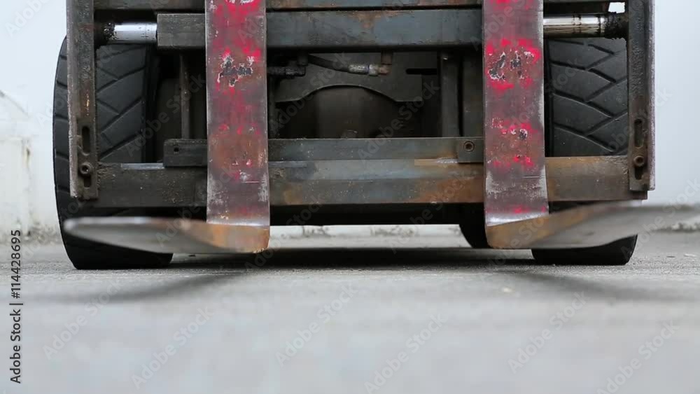 an electric forklift down view. an electric forklift down view.