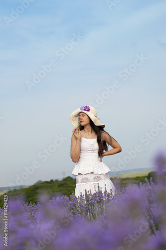 Teenager girl in a lavender field photo