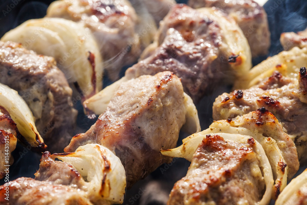 Barbecue skewers with grilled pork meat on the brazier Barbecue skewers with grilled pork meat on the brazier
