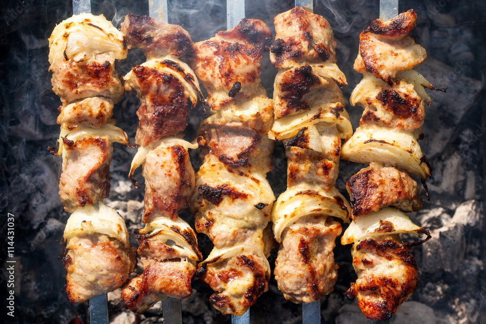 Barbecue skewers with grilled pork meat on the brazier Barbecue skewers with grilled pork meat on the brazier