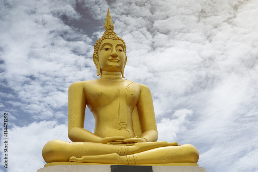 Gold image of Buddha with blue sky and cloud in background, light effect added , prachuapkhirikhan,thailand,filtered image Gold image of Buddha with blue sky and cloud in background, light effect added , prachuapkhirikhan,thailand,filtered image