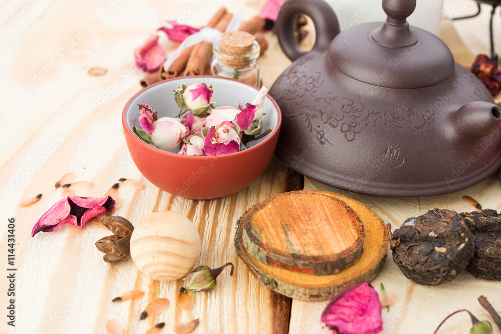 dry tea leaves cinnamon and on wooden background dry tea leaves cinnamon and on wooden background