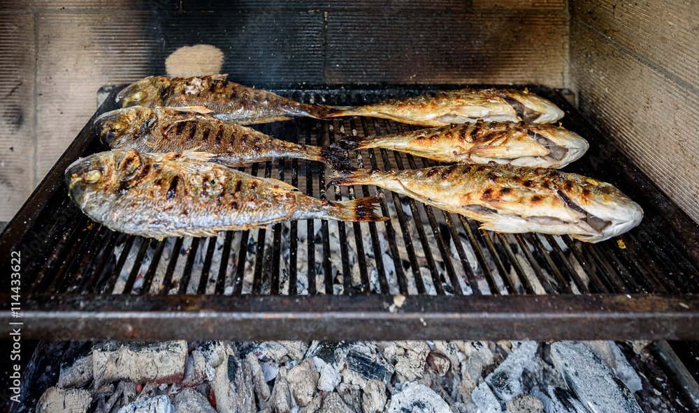 Preparing Fish on the charcoal grill