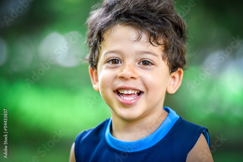 Happy boy child is smiling enjoying adopted life.