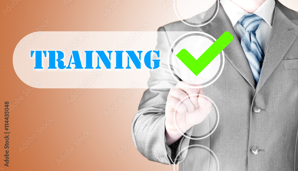 Businessman pressing touch screen interface training checkbox Businessman pressing touch screen interface training checkbox
