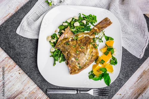 Bilde på lerret Grilled flounder with spinach and orange salsa with fresh mint