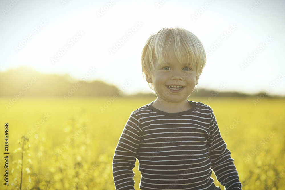 Portrait of smiling boy in canola field Portrait of smiling boy in canola field