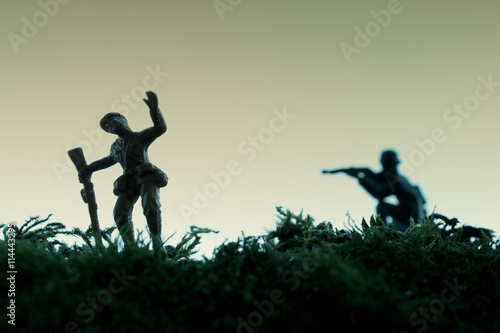 Canvas Print Death of a toy soldier killed from the back