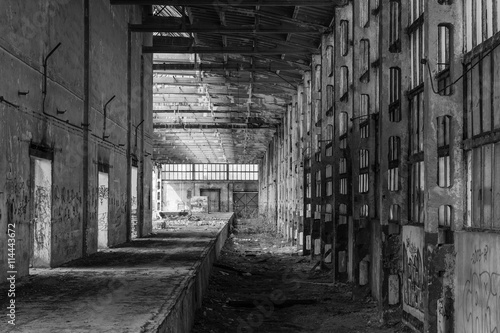 Abandoned factory hall, industrial background, black and white picture