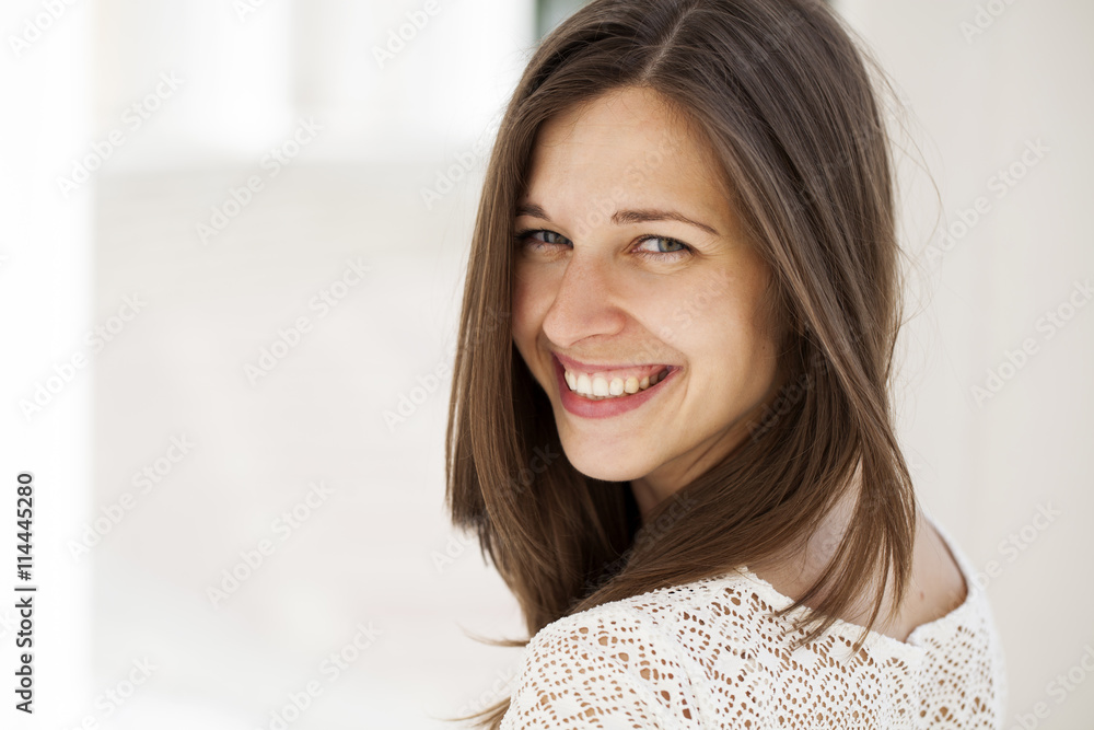 Closeup portrait of a happy young woman smiling Closeup portrait of a happy young woman smiling