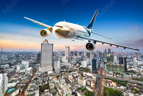 Airplane over cityscape