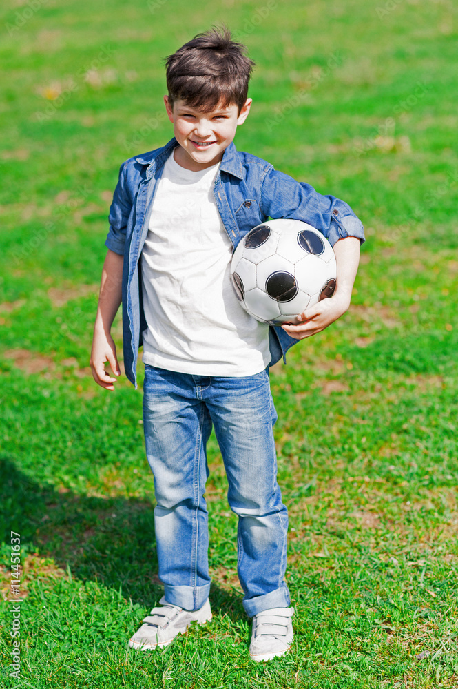 Happy small boy is entertaining in park Happy small boy is entertaining in park