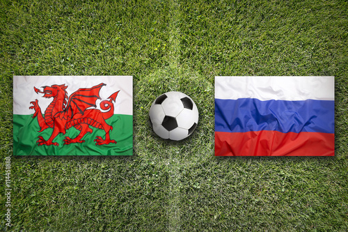 Wales vs. Russia flags on soccer field