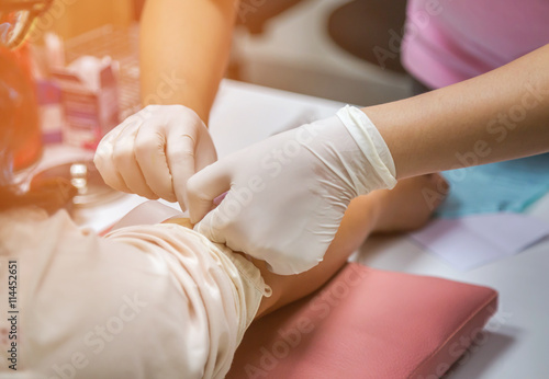 nurse drawing blood sample from arm patient for blood test