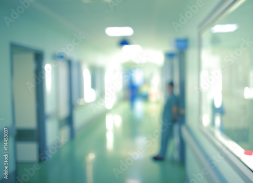 Workers silhouette in hospital corridor, unfocused background