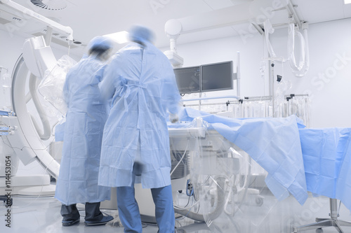 Doctors working in hospital cathlab photo