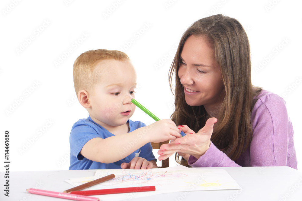 Mother and son are drawing the picture together Mother and son are drawing the picture together