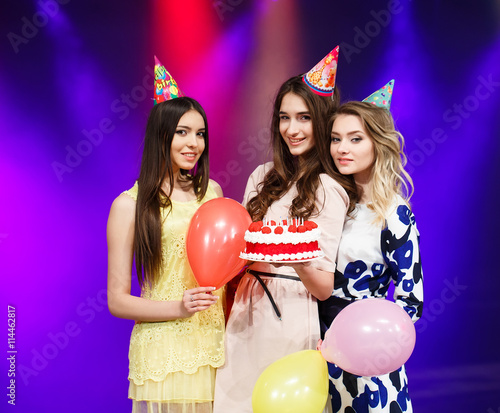 Happy birthday! Group of smiling friends gathered together with