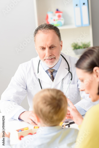 Little boy with his mother at doctor on consultation