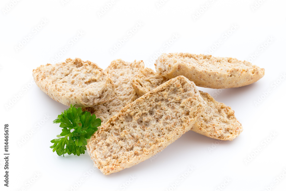 Dry flat bread crisps with herbs on a white background. Dry flat bread crisps with herbs on a white background.
