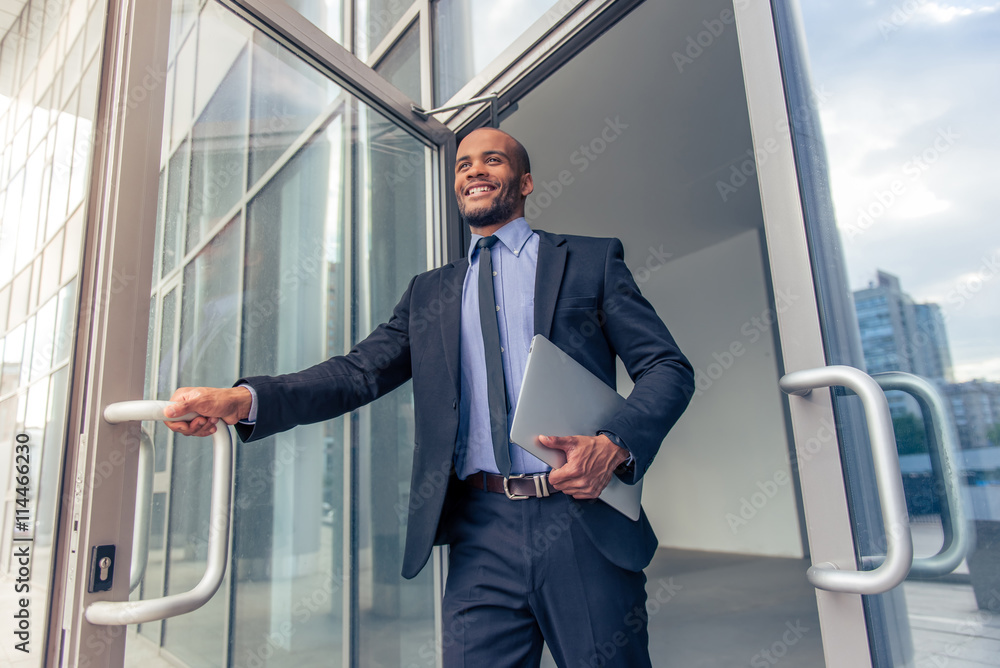 Afro American businessman with gadget