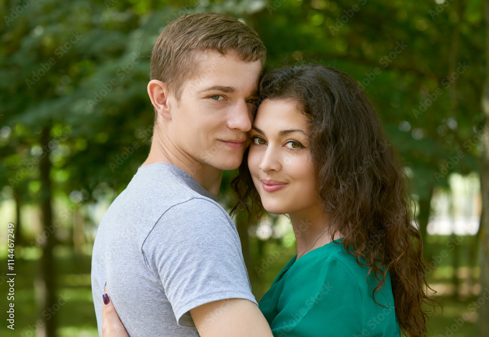 Romantic couple posing in city park, summer season, lovers boy and girl  Stock Photo | Adobe Stock