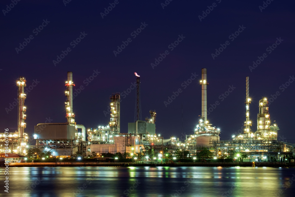 Oil refinery / Oil refinery reflex on river at night.