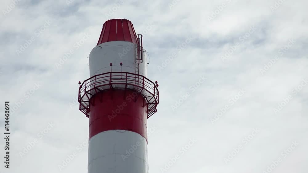 Exterior view of a industrial nuclear power plant. A pipe for discharge of gas Exterior view of a industrial nuclear power plant. A pipe for discharge of gas