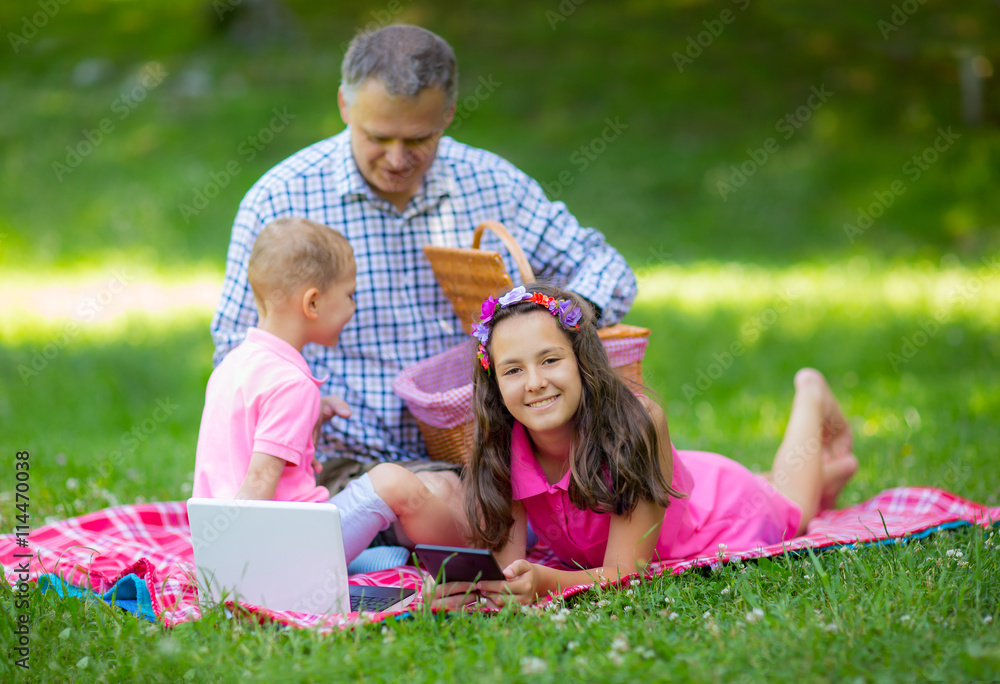 Father enjoying with your children at the picnic Father enjoying with your children at the picnic