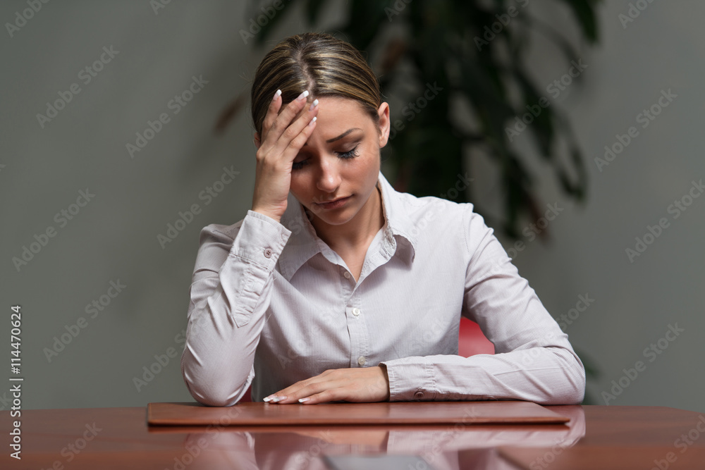 Portrait Of Tired Woman Touching Her Head Portrait Of Tired Woman Touching Her Head