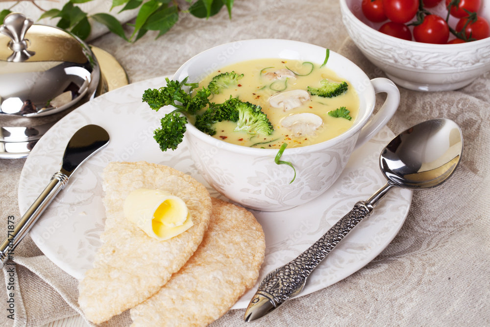 cream soup with broccoli and mushrooms still life, original cutlery, spoon, beautiful cream soup with broccoli and mushrooms still life, original cutlery, spoon, beautiful