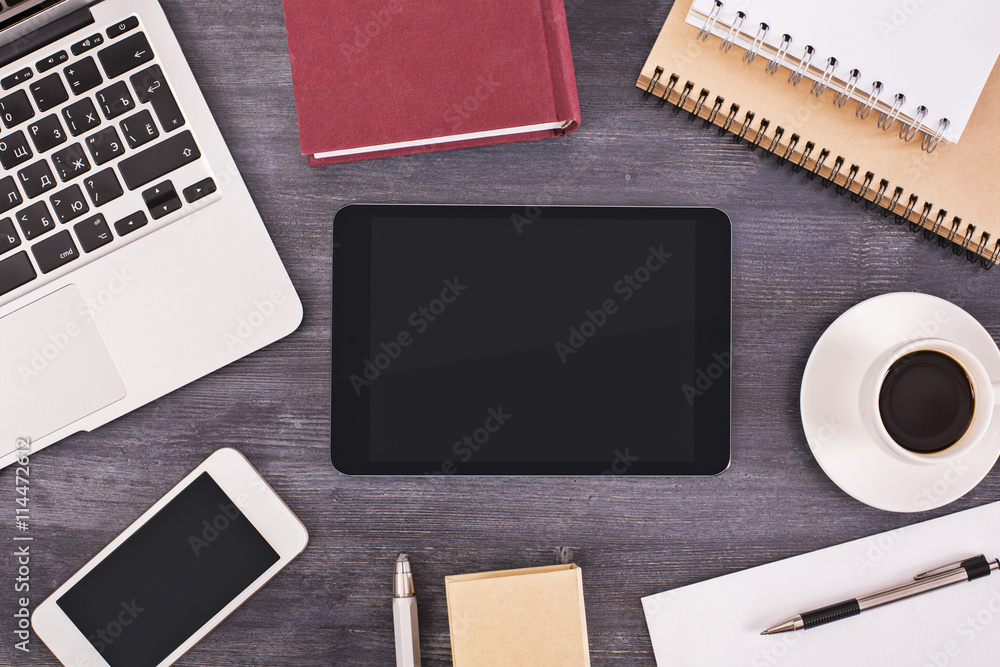 Tablet and phone on desk Tablet and phone on desk