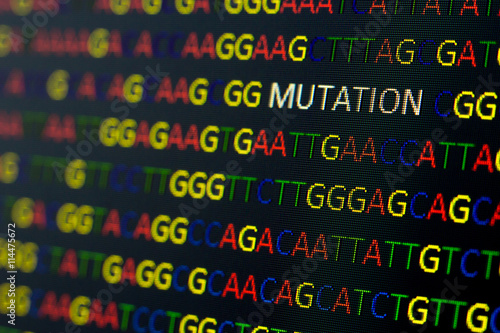 DNA sequence with colored letters on black background containing mutation