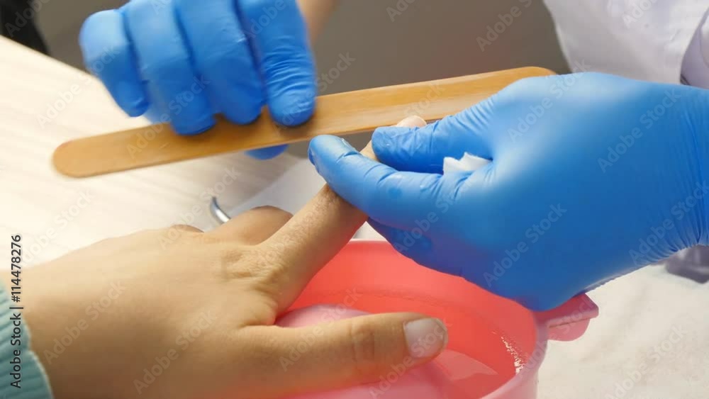 Girl makes a manicure in the salon Girl makes a manicure in the salon