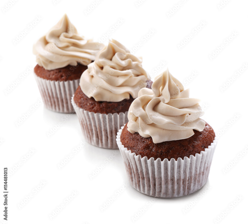 Tasty chocolate cupcakes, isolated on white Tasty chocolate cupcakes, isolated on white