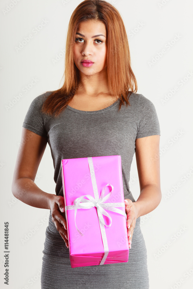 Beautiful woman with pink gift. Beautiful woman with pink gift.