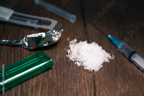 Drug syringe and cooked heroin photo