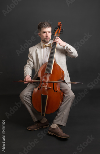 man playing the viola da gamba photo