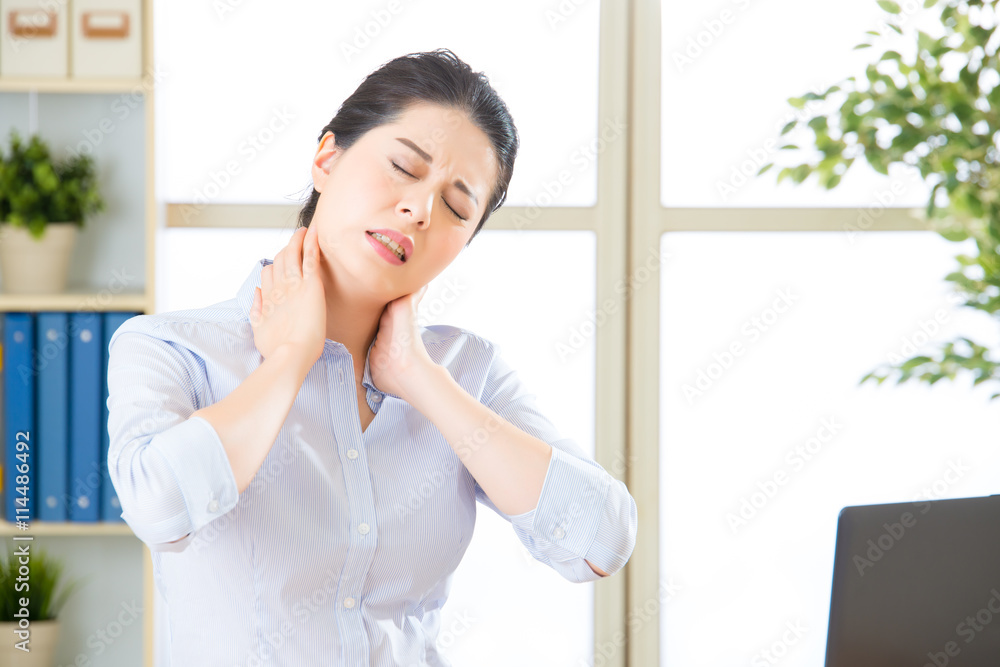 Young asian business woman with pain in neck Young asian business woman with pain in neck