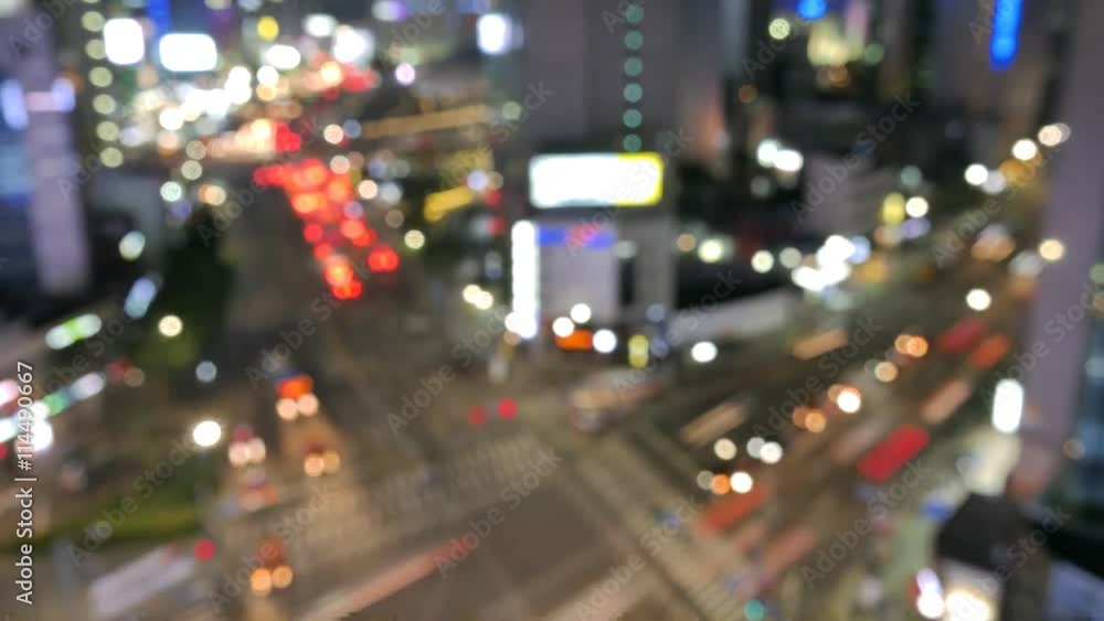 Defocused tilt up camera timelapse of the night city in 4K Defocused tilt up camera timelapse of the night city in 4K