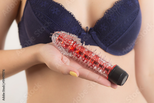 Red vibrator in hand photo